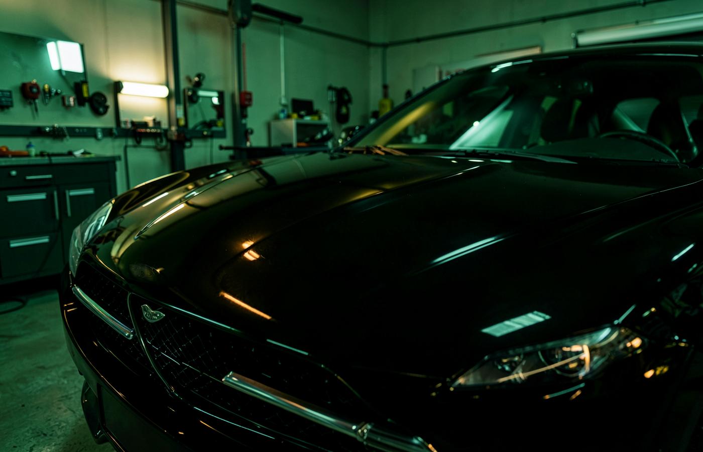 Polished luxury vehicle in a professional detailing bay